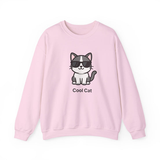 A light pink crewneck sweatshirt featuring a cartoon graphic of a cool cat wearing black sunglasses with the text 'Cool Cat' printed below it.