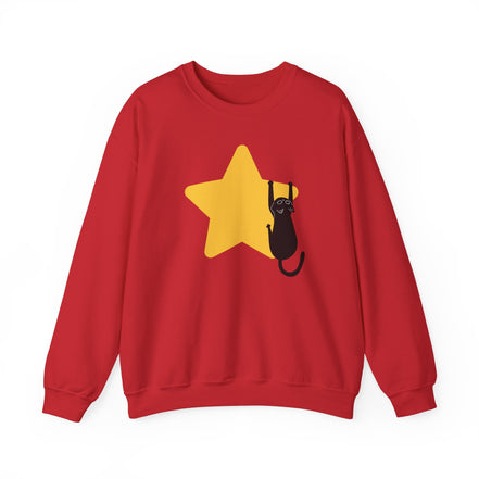 A red crewneck sweatshirt featuring a graphic of a black cat climbing a yellow star on the front, displayed against a solid white background.