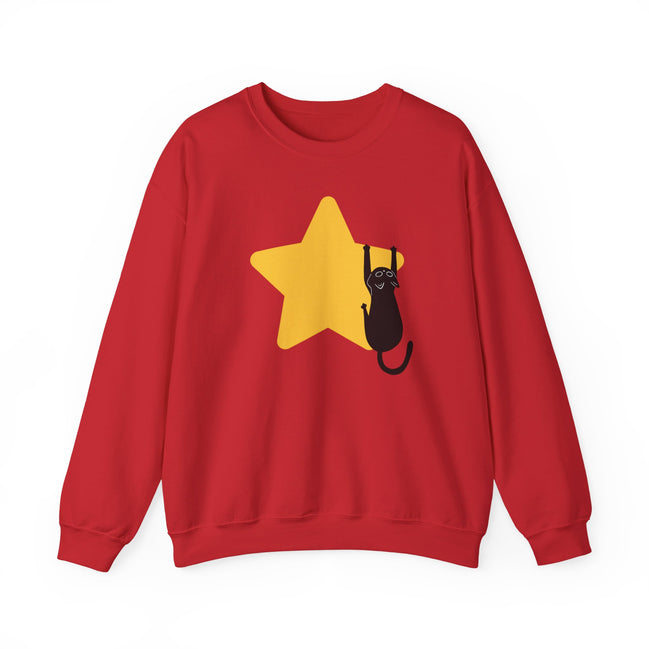A red crewneck sweatshirt featuring a graphic of a black cat climbing a yellow star on the front, displayed against a solid white background.