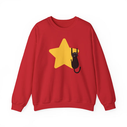 A red crewneck sweatshirt featuring a graphic of a black cat climbing a yellow star on the front, displayed against a solid white background.