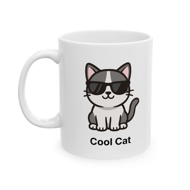 A white ceramic mug featuring a cartoon illustration of a black and white cat wearing black sunglasses, with the text 'Cool Cat' printed below.