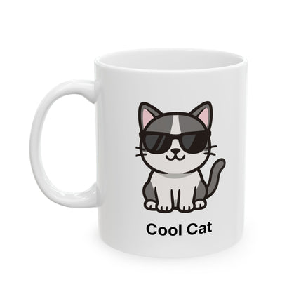 A white ceramic mug featuring a cartoon illustration of a black and white cat wearing black sunglasses, with the text 'Cool Cat' printed below.