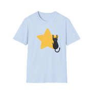 A light blue short-sleeve crewneck t-shirt featuring a graphic of a black cat climbing a yellow star on the front, displayed against a solid white background.
