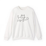 A white  crewneck sweatshirt featuring a simple black line art graphic of a playful kitten chasing  a heart, displayed against a clean white background.