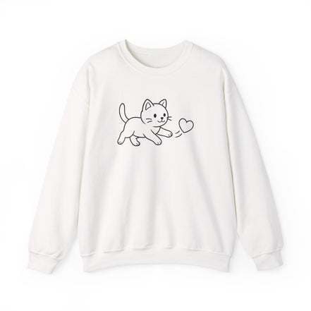 A white  crewneck sweatshirt featuring a simple black line art graphic of a playful kitten chasing  a heart, displayed against a clean white background.