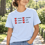 A  tee worn by young woman in jeans outside tee has a two rows of hearts with equal signs. in a row next to the = signs are the words 