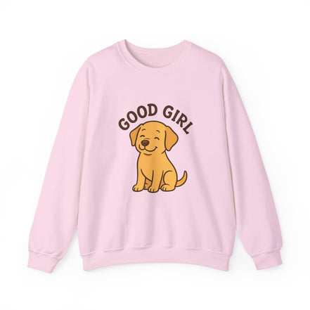 A light pink crewneck sweatshirt featuring a cartoon graphic of a yellow Labrador Retriever with the text 'GOOD GIRL' arched above it, displayed on a clean white background.