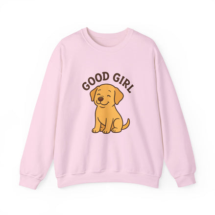 A light pink crewneck sweatshirt featuring a cartoon graphic of a yellow Labrador Retriever with the text 'GOOD GIRL' arched above it, displayed on a clean white background.