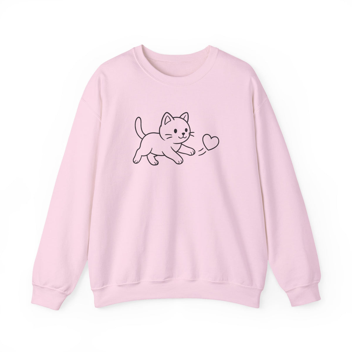 A light pink crewneck sweatshirt featuring a simple black line art graphic of a cat chasing a  small heart on the chest, displayed against a clean white background.